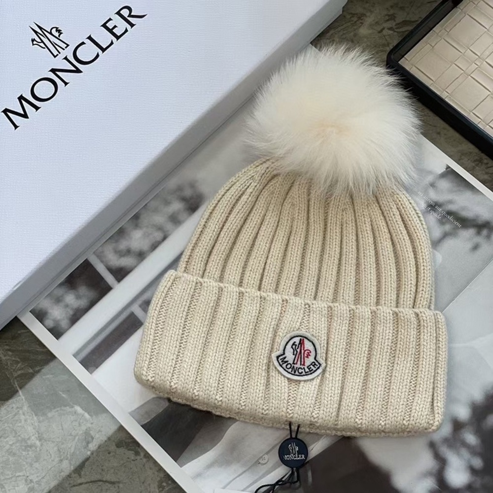 Moncler Warm Knitted Hat With A Foldable Brim.
